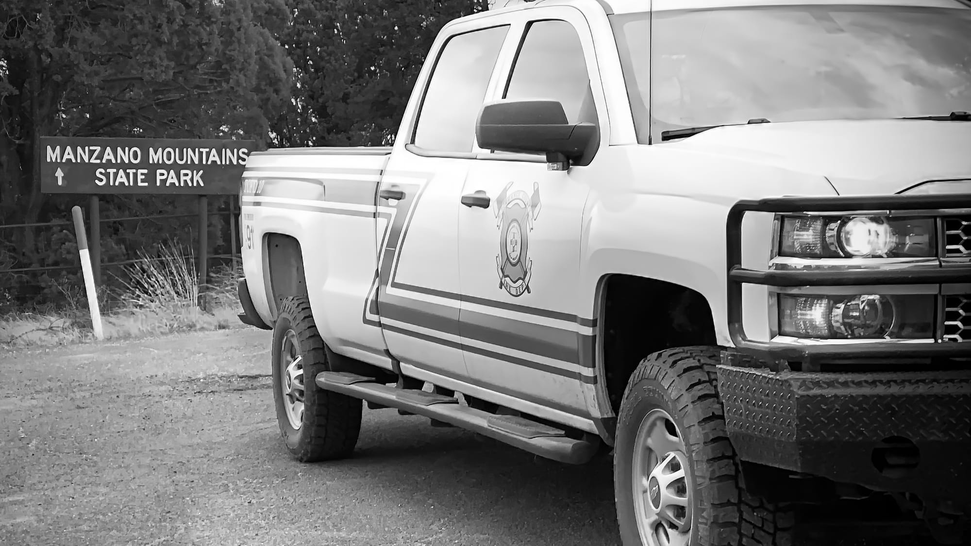 A pick-up truck with the logo of Torrance County Fire Department on the door.