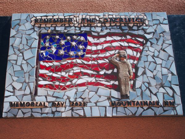 Tomas Wolff's Memorial Day Mosaic reads "Remember the Sacrifice - Memorial Day 2023 - Mountainair, NM."